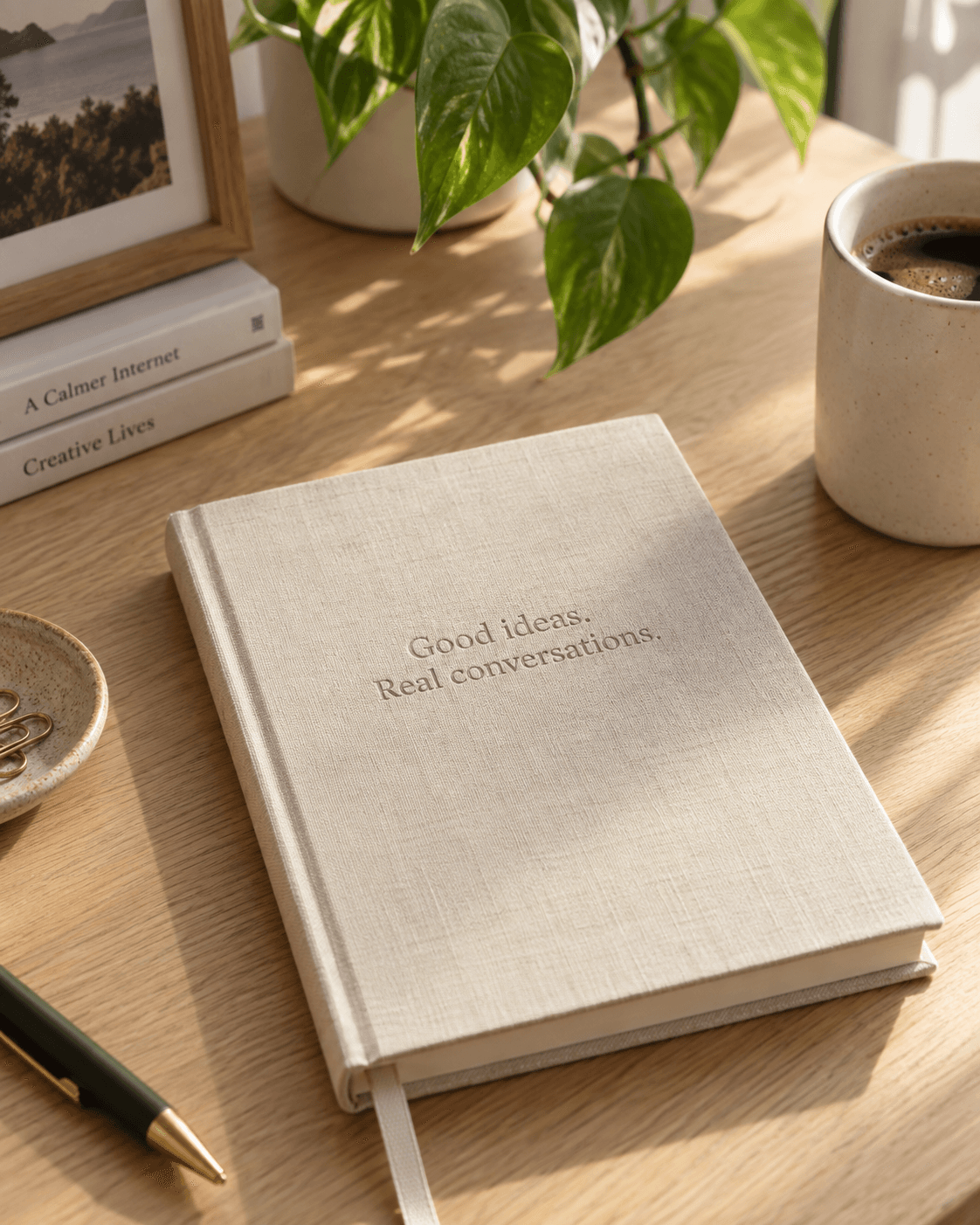 A notebook and coffee on a creator’s desk